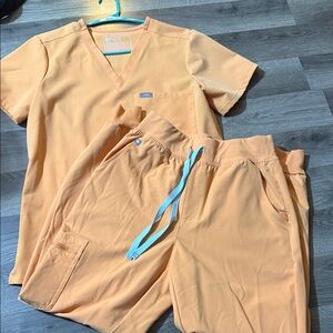 Figs Vibrant Orange Scrub Set with Blue Accents